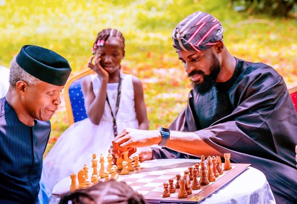 Tunde Onakoya playing chess with Osibanjo