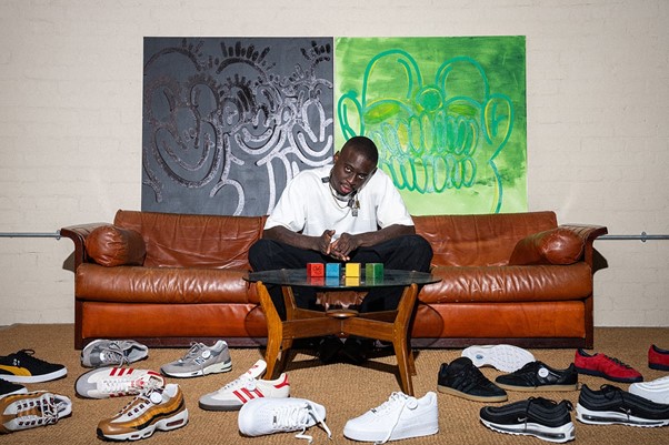Olaolu Slawn showcasing his shoes