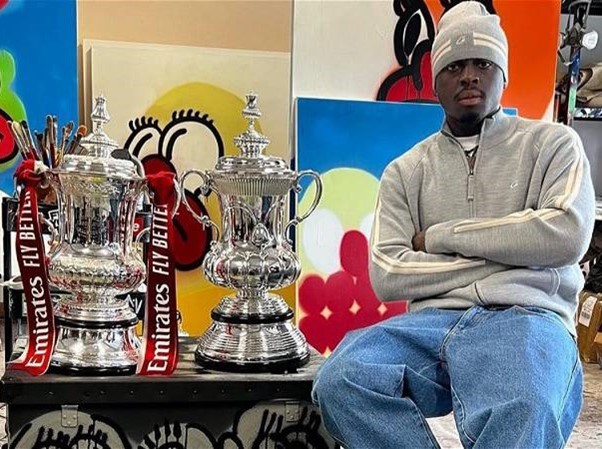Olaolu Slawn posing with the FA cup