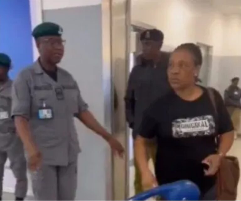 Nigerian woman tears husband's passport in anger