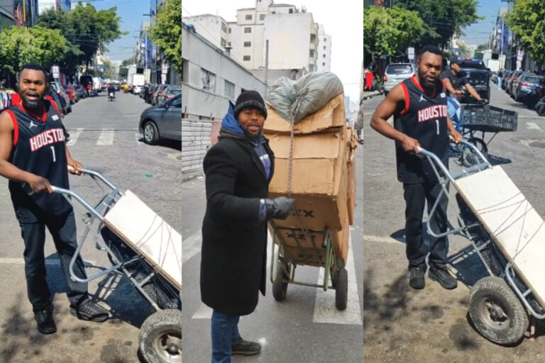 Nigerian pushing wheelbarrow in Brazil